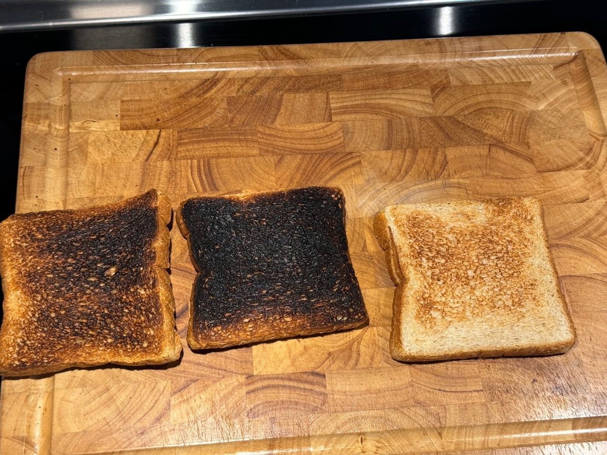 A photo that shows three pieces of toast, the first a little dark, the second a lot dark, and the third about right. 